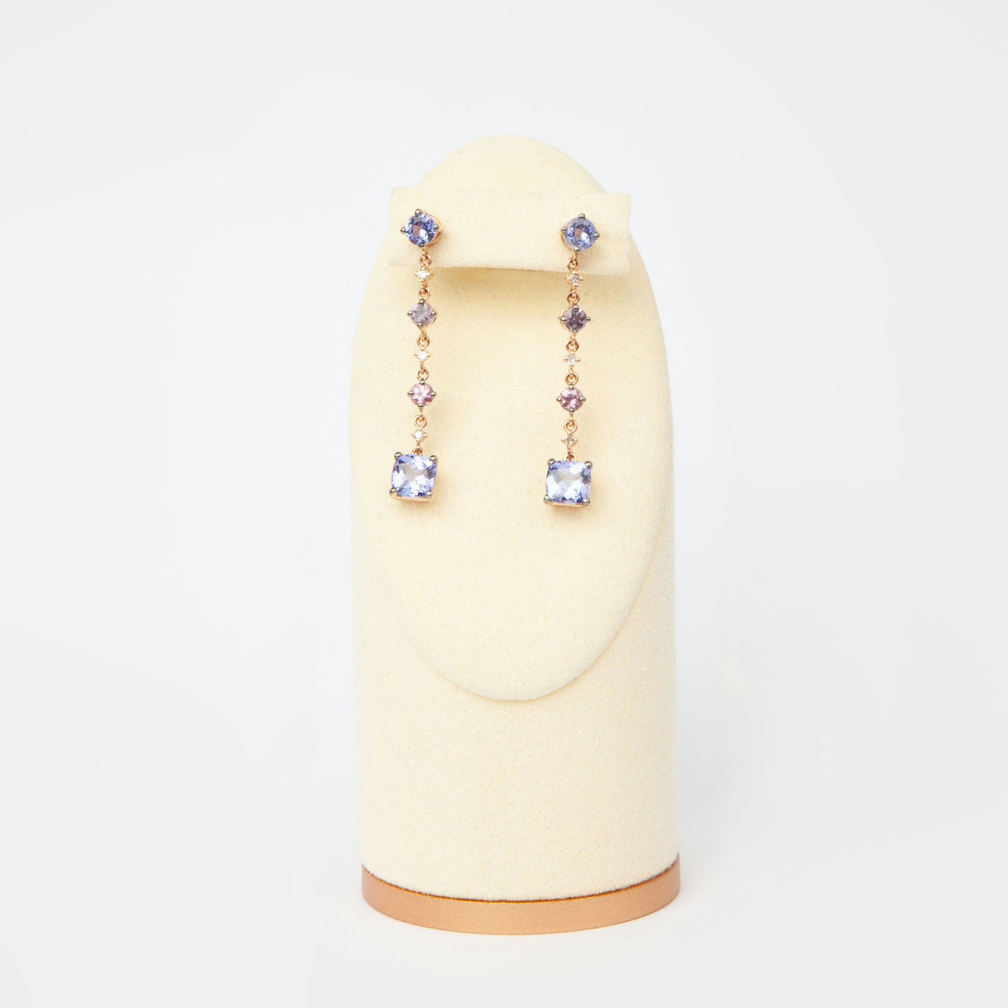 Drop earrings in 18K rose gold featuring 2.833 ct total weight of blue and pink sapphires, and round-cut diamonds.