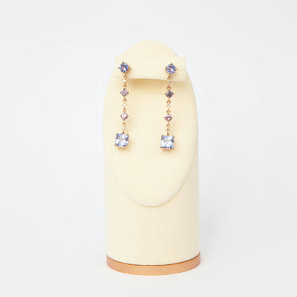Drop earrings in 18K rose gold featuring 2.833 ct total weight of blue and pink sapphires, and round-cut diamonds.