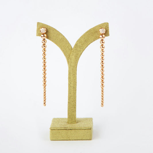 Long drop earrings in 18K pink gold featuring 14 natural diamonds totaling 0.20 ct and a beaded design.