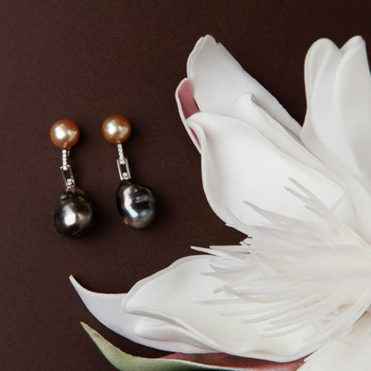 Earrings in 18K white gold featuring 10 mm South Sea pearls, 15 mm black baroque pearls, and 10 diamonds totaling 0.21 ct.
