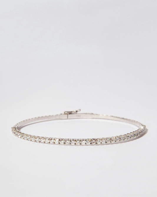Bangle bracelet in 18K white gold featuring 37 natural diamonds totaling 1.39 carats.