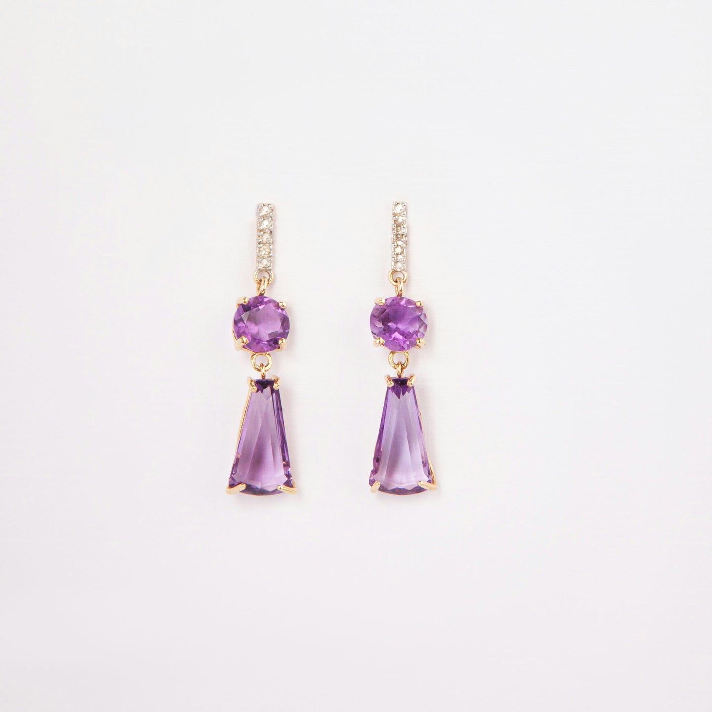 14K gold earrings featuring amethysts and diamond accents.