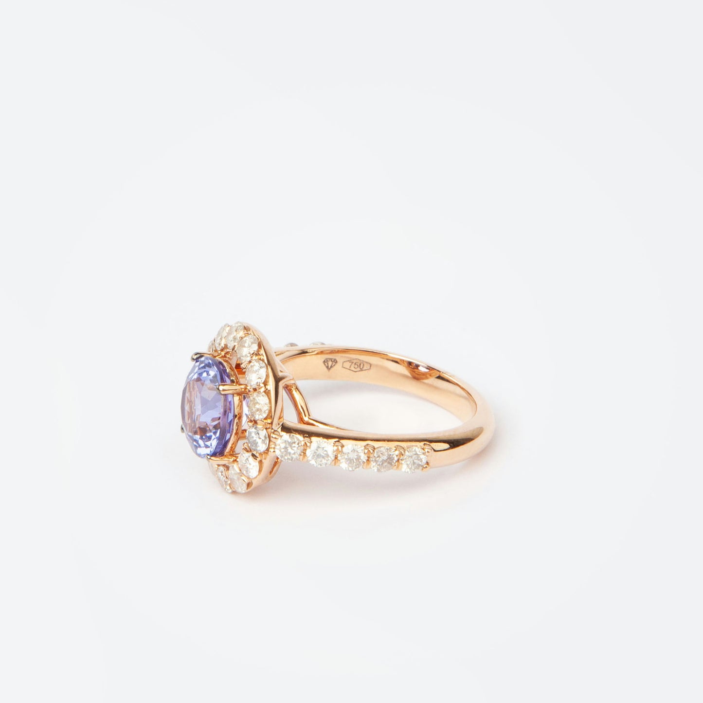 18K rose gold ring featuring 2.55 ct natural tanzanite and 24 natural diamonds totaling 1.211 ct.