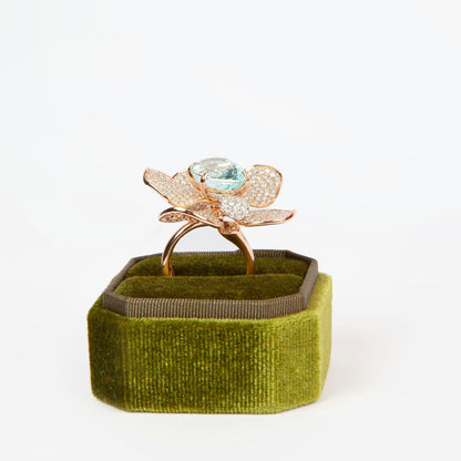 Statement ring in 18K rose gold featuring 9.2 ct GIA-certified green Paraiba tourmaline and 4.00 ct natural diamonds.