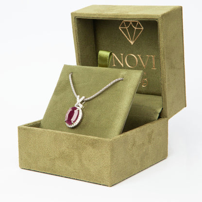 14-karat white gold pendant featuring a 6.75ct natural ruby and 40 diamonds totaling 0.51ct, certified by IGI.