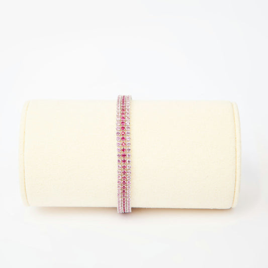 18K white gold bracelet featuring 294 natural rubies and pink sapphires totaling approximately 5.78 carats, length 18 cm.