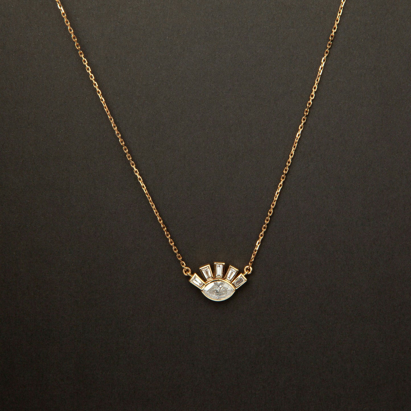 18K white gold necklace featuring 1.01 ct marquise diamond and 0.62 ct trapezoid-cut diamonds, IGI and IGE certified.