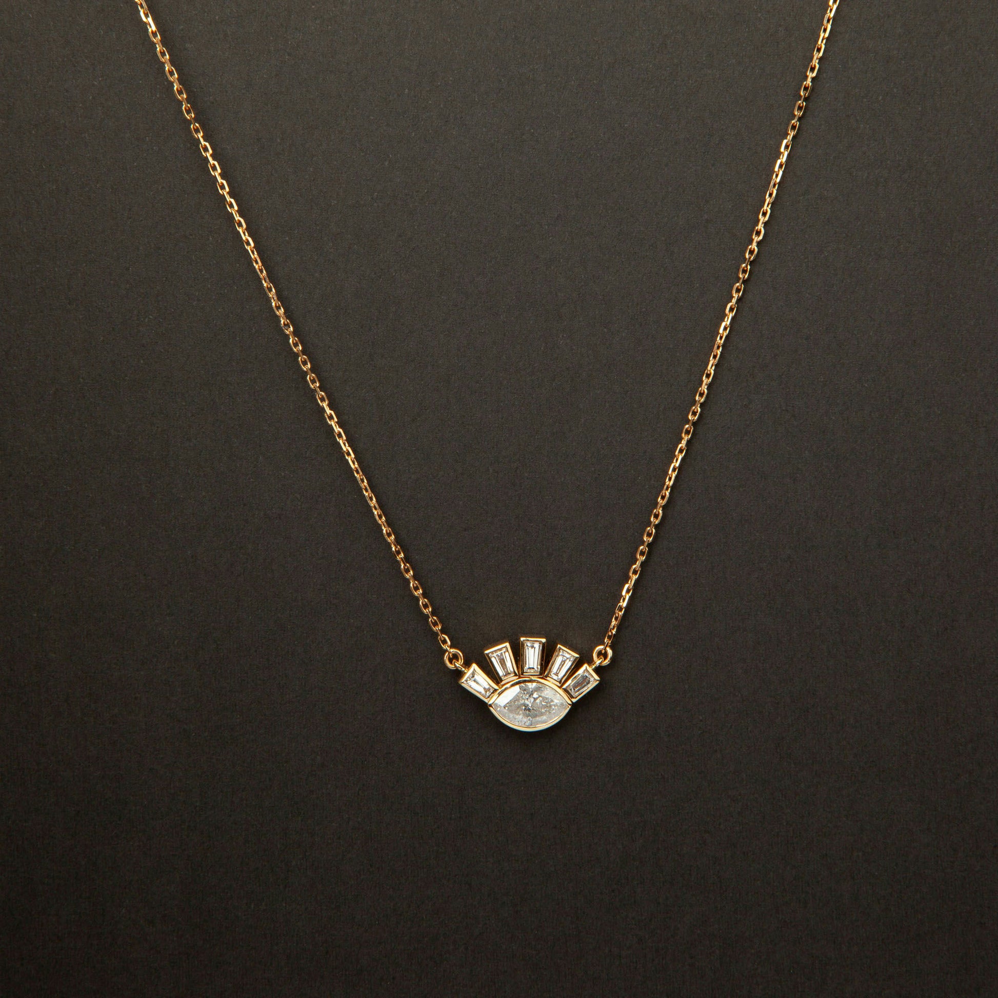 18K white gold necklace featuring 1.01 ct marquise diamond and 0.62 ct trapezoid-cut diamonds, IGI and IGE certified.