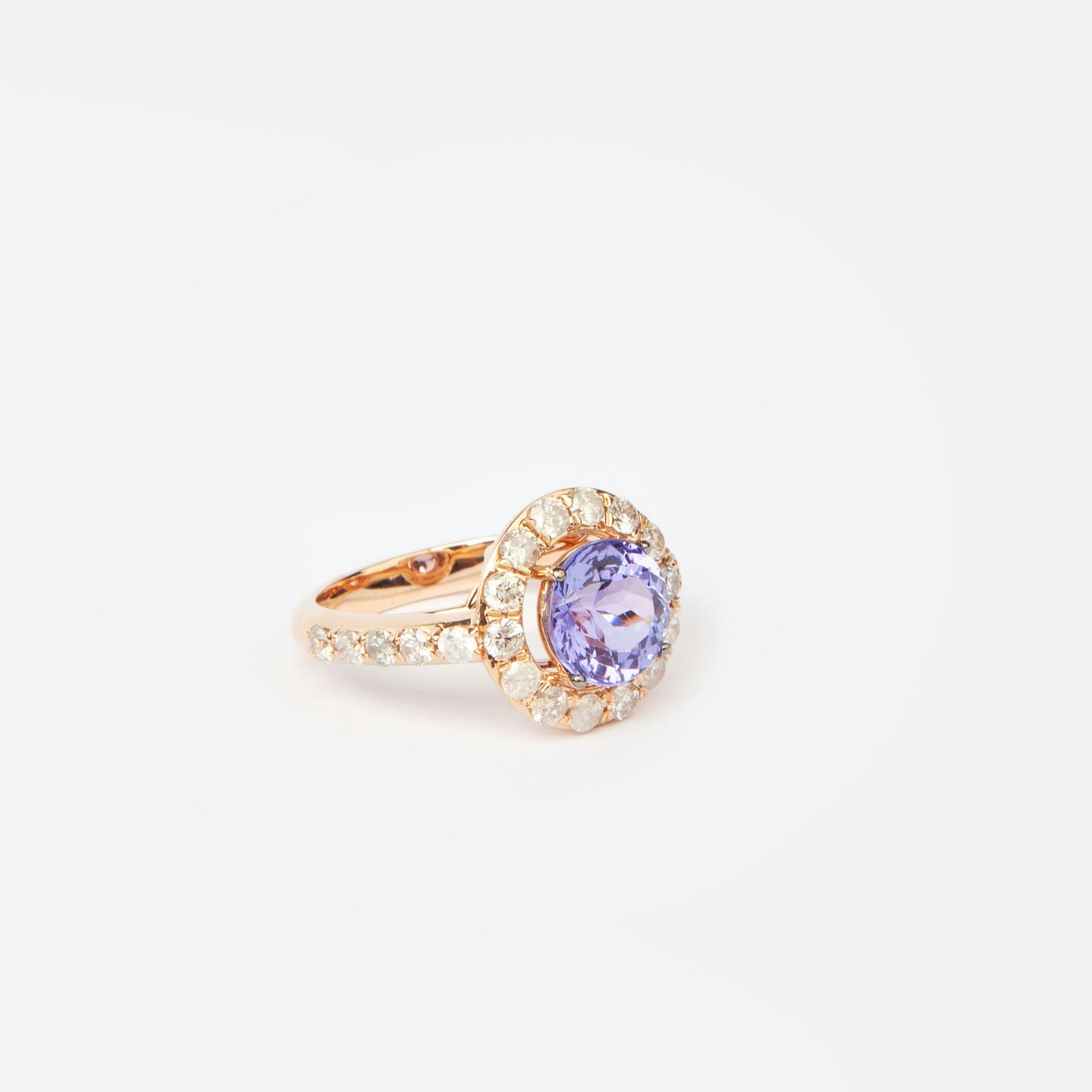18K rose gold ring featuring 2.55 ct natural tanzanite and 24 natural diamonds totaling 1.211 ct.