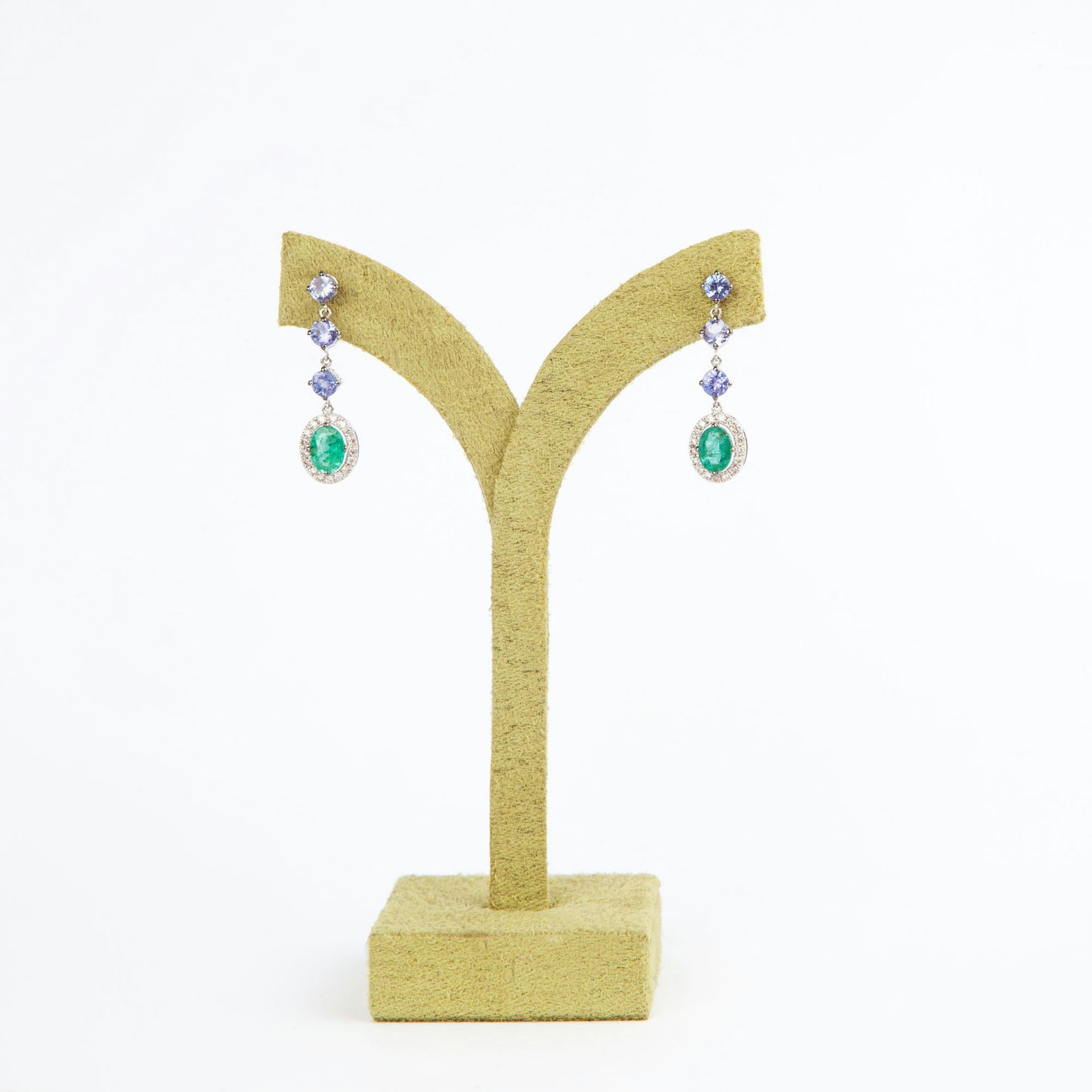18K White Gold drop earrings featuring 1.51 ct Natural Emeralds and 1.65 ct Natural Tanzanites with diamond accents.