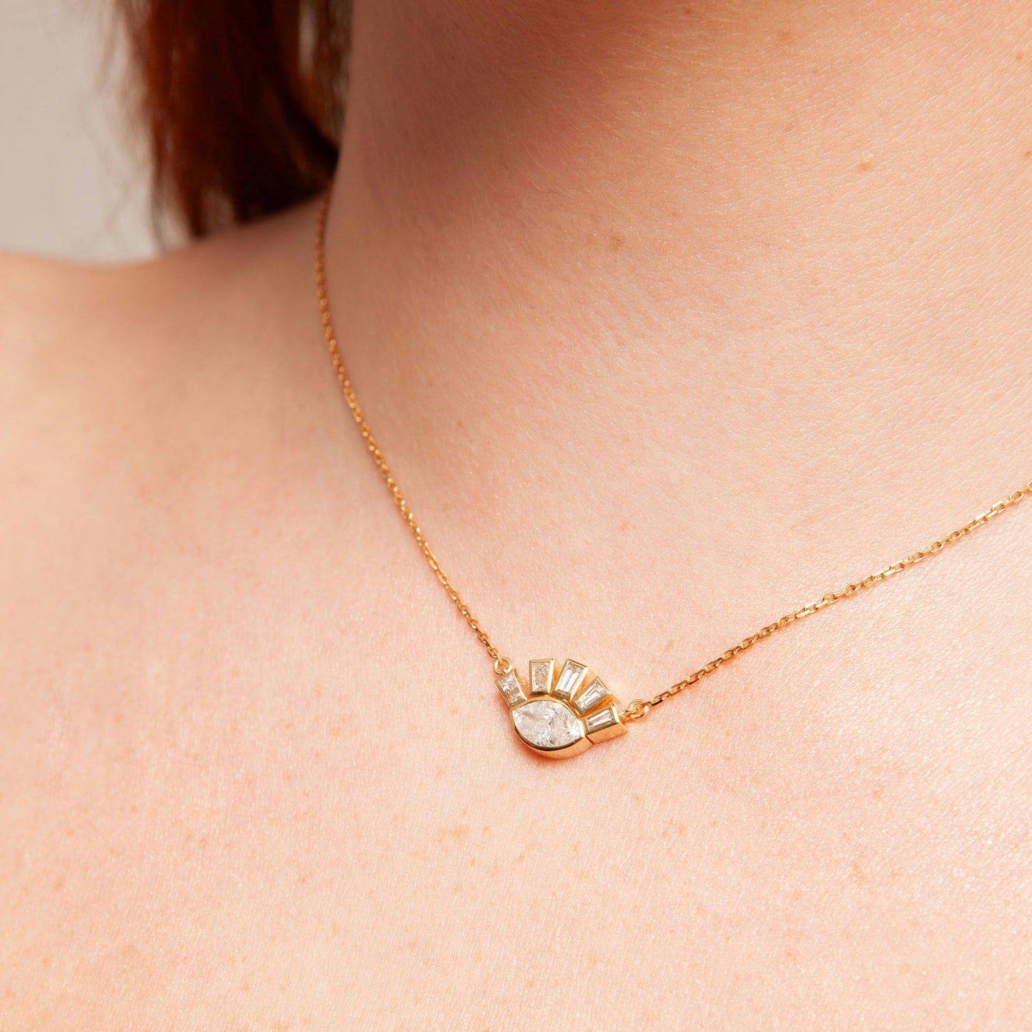 18K white gold necklace featuring 1.01 ct marquise diamond and 0.62 ct trapezoid-cut diamonds, IGI and IGE certified.